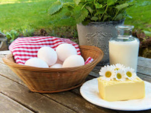 eggs, milk, and real butter on wood deck