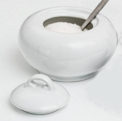 white bowl with sugar and spoon