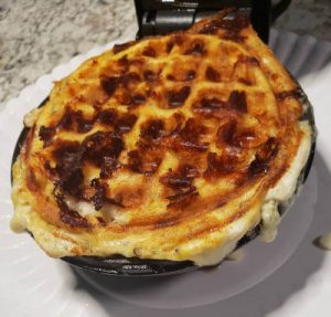 Cooked chaffle ready to remove from mini waffle maker