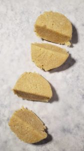 keto stuffed sandwich dough cut into fourths.