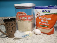 ingredients for 90 second keto bread: almond flour, psyllium husk powder, baking powder, egg, and butter.